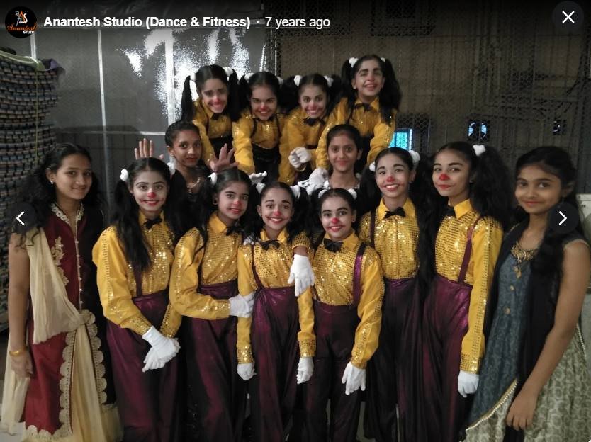Kids ensemble in gold and maroon costumes
