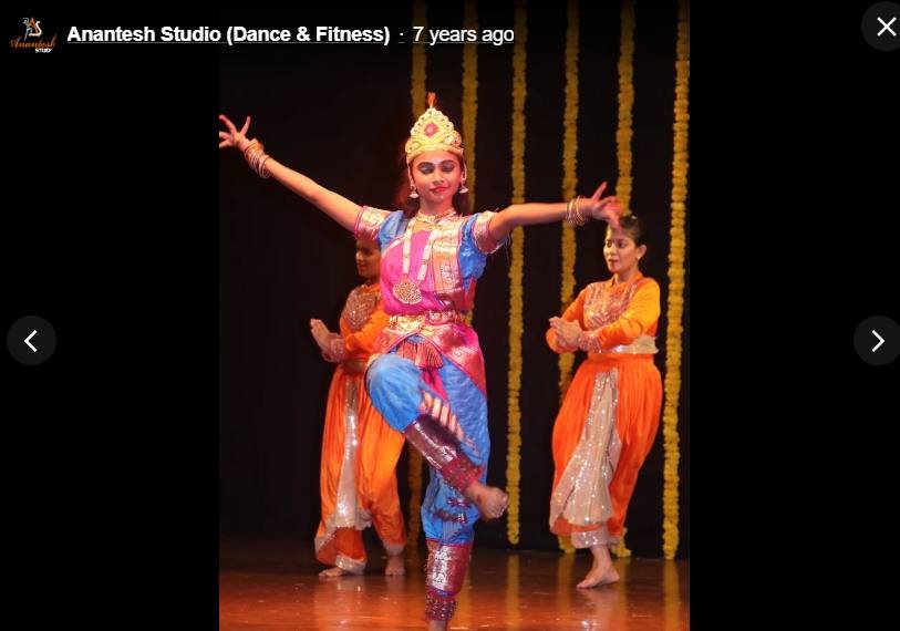 Kathak solo dancer in traditional costume mid-performance
